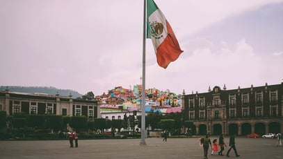 People Near Mexican Flag