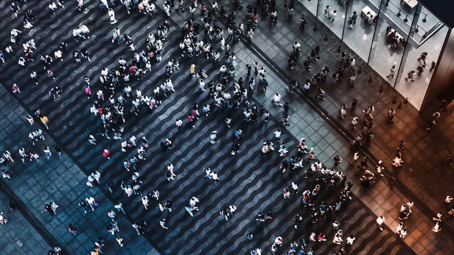 Aerial View of Crowded Pedestrians Walking on the Business Street at Night 