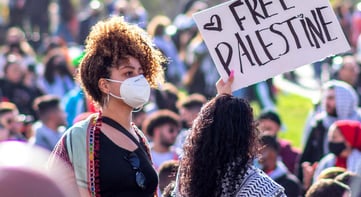 student holding a sign at a protest