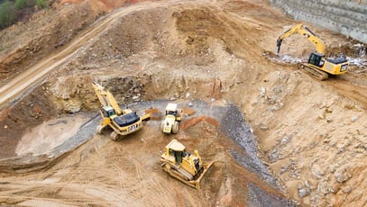 diggers in a mining field