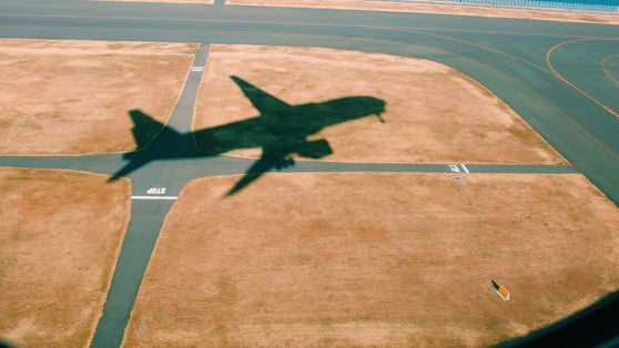 High Angle View Of Airplane On Airport Runway