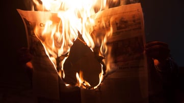 Newspaper on fire