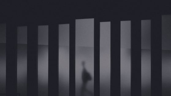 Business person seen through a window