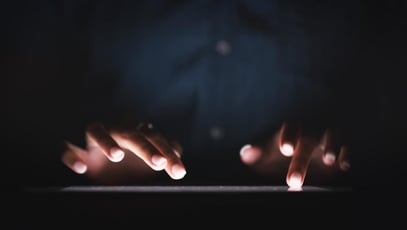 Fingers typing on a keyboard