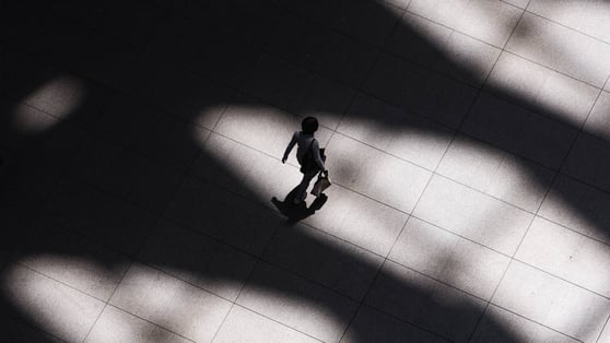 Arial photograph of Person with a briefcase walking